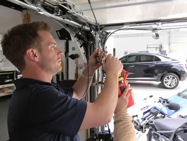 Abington Garage Door Repair safety certified technician performing cable replacement in Abington