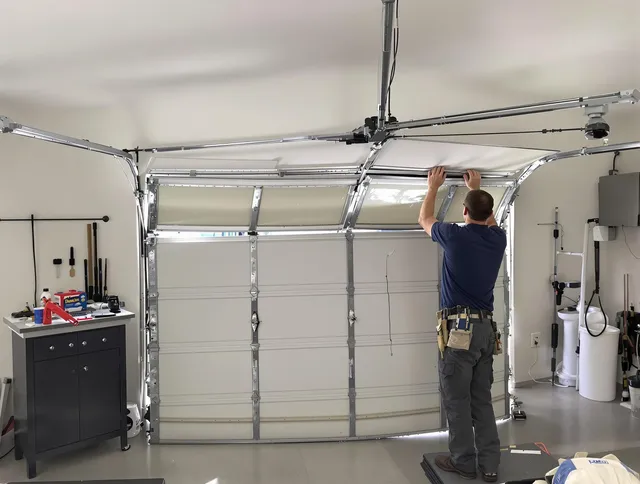 Abington Garage Door Repair specialist performing precise section replacement on Abington garage door