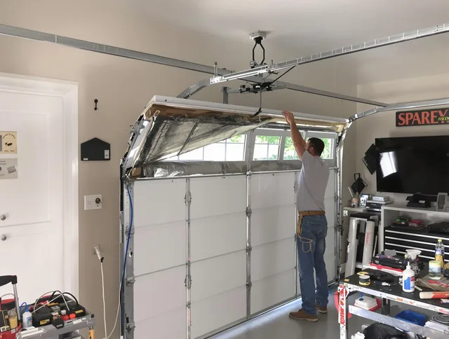 Garage door section replacement by Abington Garage Door Repair in Abington